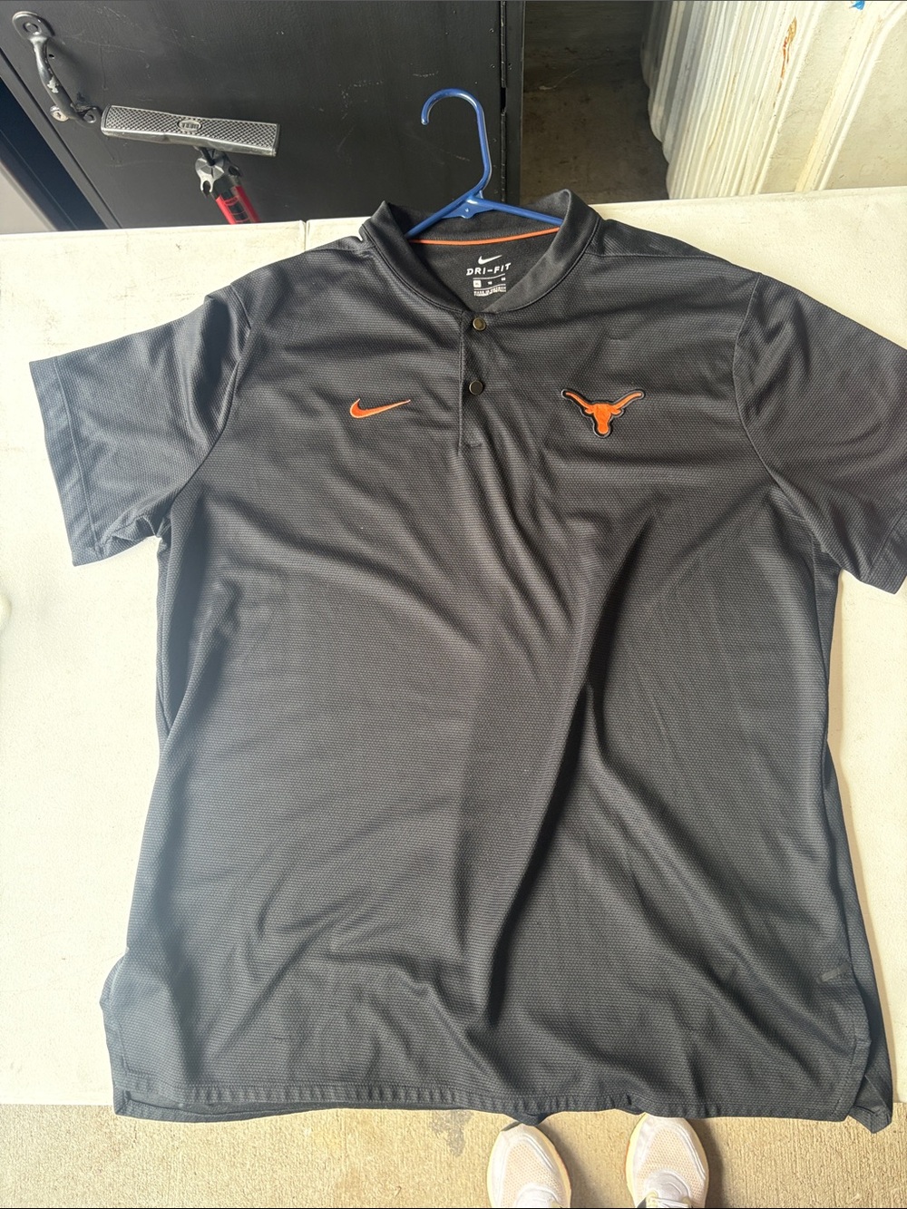 Nike Men’s Black Polo with Orange Swoosh and Longhorn Logo